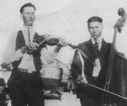 Joe Szymanski on left, unknown musician on right